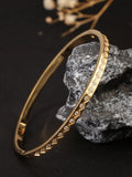 Guldfärgat armband i rostfritt stål med strass – geometrisk cuff design