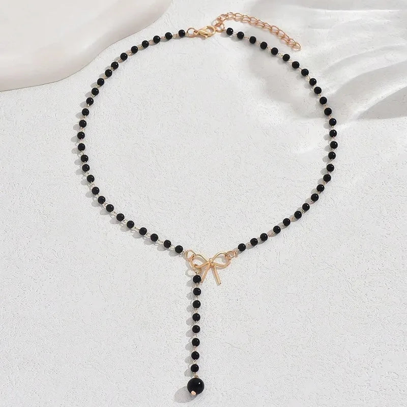 Halsband dam – pärlchoker med rosett svarta