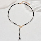 Halsband dam – pärlchoker med rosett svarta