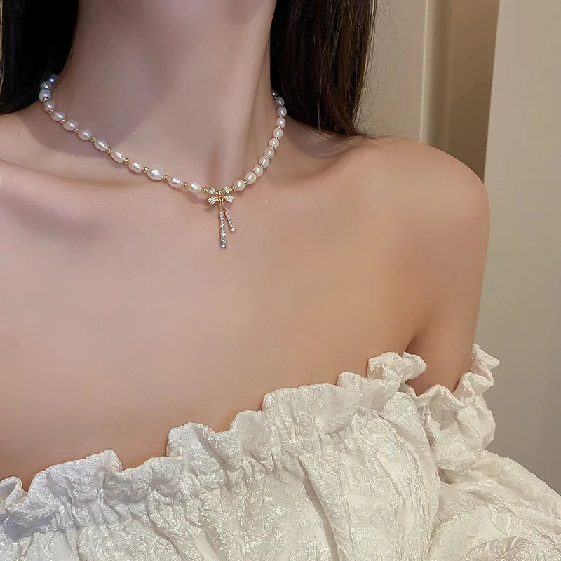 Pärlhalsband dam – rosett i 14K guld