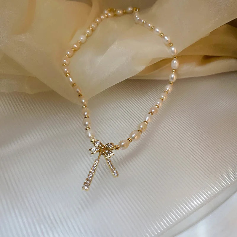 Pärlhalsband dam – rosett i 14K guld
