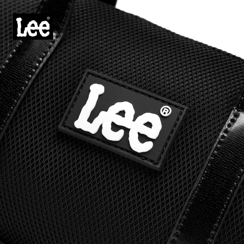 Svart Lee mini-handväska med dubbla handtag och justerbar axelrem.