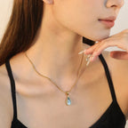 Halsband dam droppformat – minimalistiskt transparent hänge i stål