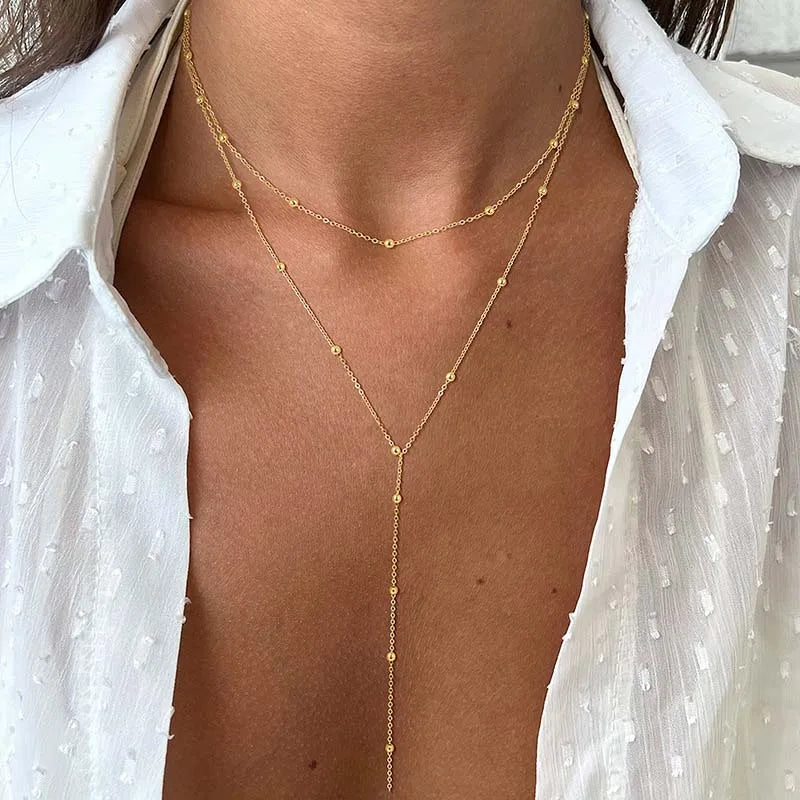 Guldpläterat lariat halsband i dubbla lager med dropphänge