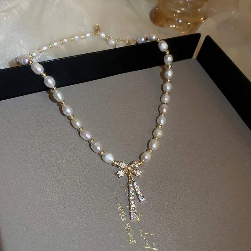 Pärlhalsband dam – rosett i 14K guld