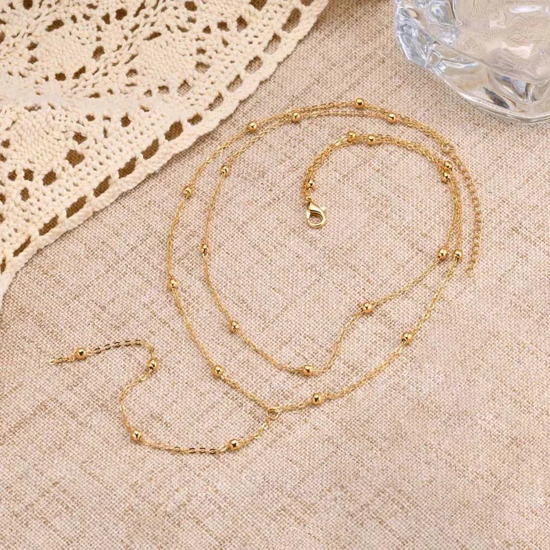 Guldpläterat lariat halsband i dubbla lager med dropphänge