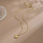 Guldpläterat halsband med hjärthänge och gravyr