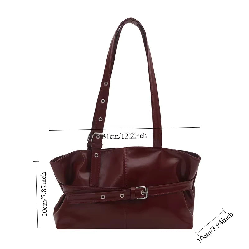 Damväska Suede Tote – stilren bucket bag med spänndetalj