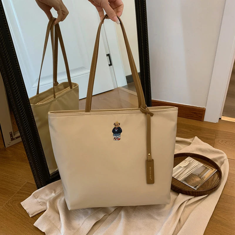 Stor axelväska‑väska i oxfordtyg för dam – pendlarväska & reseväska