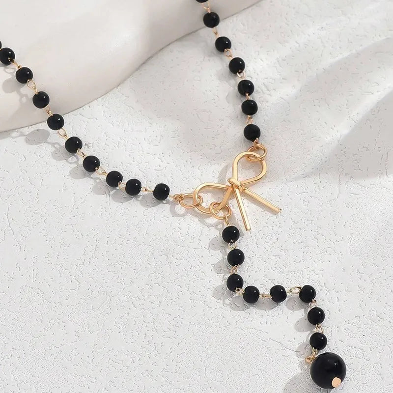 Halsband dam – pärlchoker med rosett svarta