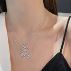 Hjärta och lyckoklöver halsband med öppningsbart hänge och zirkoner