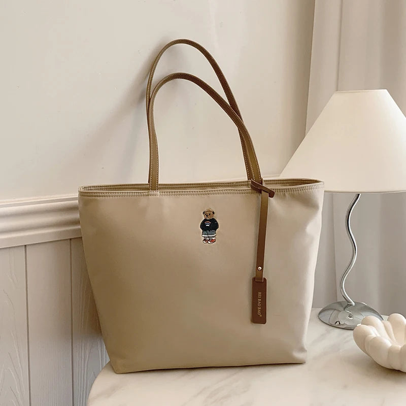 Stor axelväska‑väska i oxfordtyg för dam – pendlarväska & reseväska