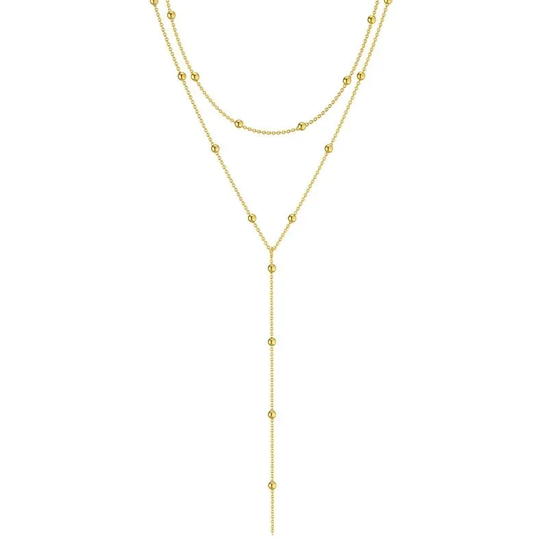 Halsband dam – dubbellager halsband med tofs i guldton