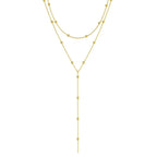 Halsband dam – dubbellager halsband med tofs i guldton