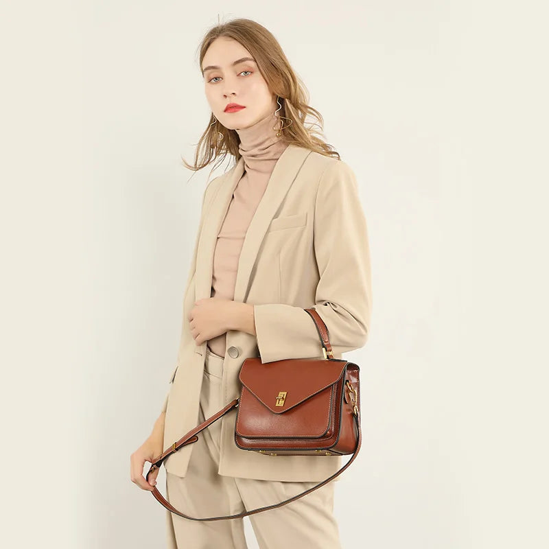 Axelväska i äkta läder dam – klassisk & kompakt crossbody